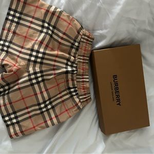 Burberry swimming trunks toddlers. Still have box.